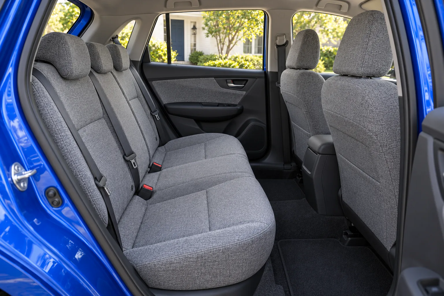 Gray cloth rear seating inside the cobalt-blue hatchback