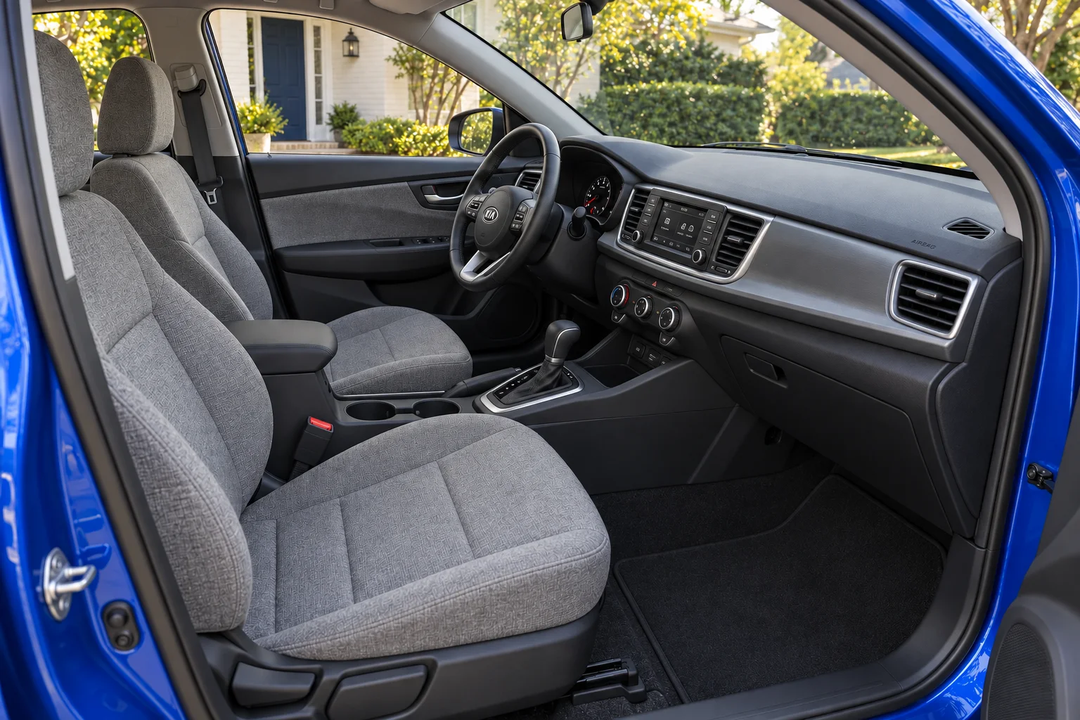Gray cloth front cabin of the cobalt-blue hatchback