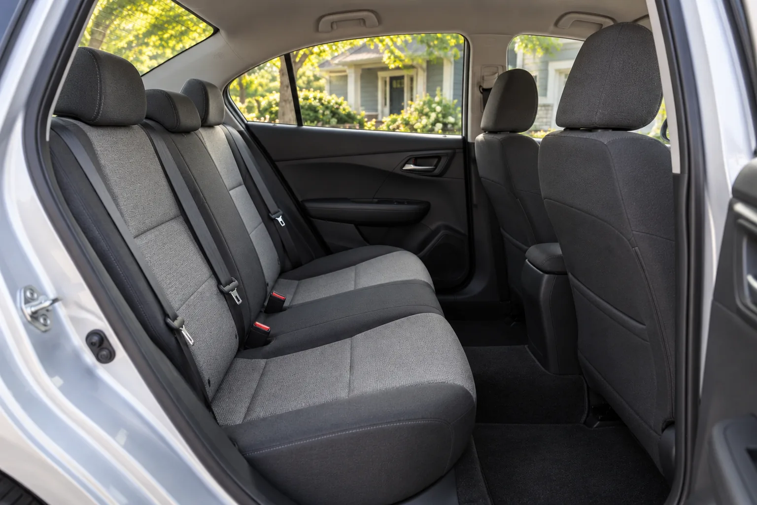 Gray cloth rear bench in the everyday silver sedan
