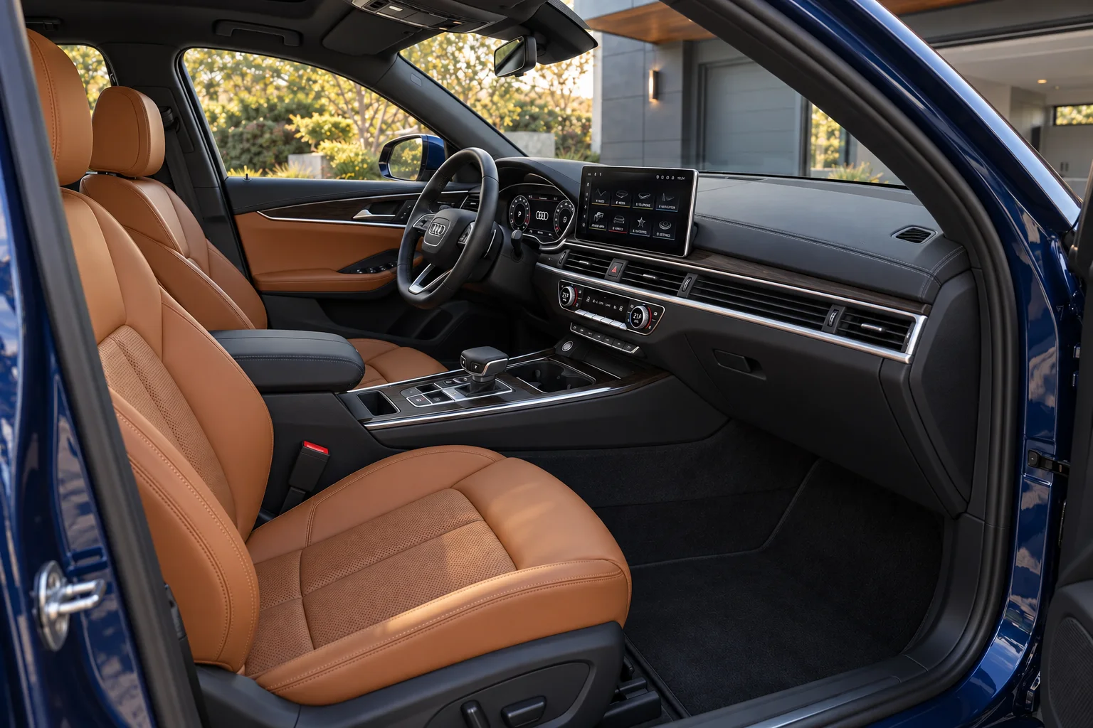 Saddle-brown leather front interior of the deep blue sports sedan