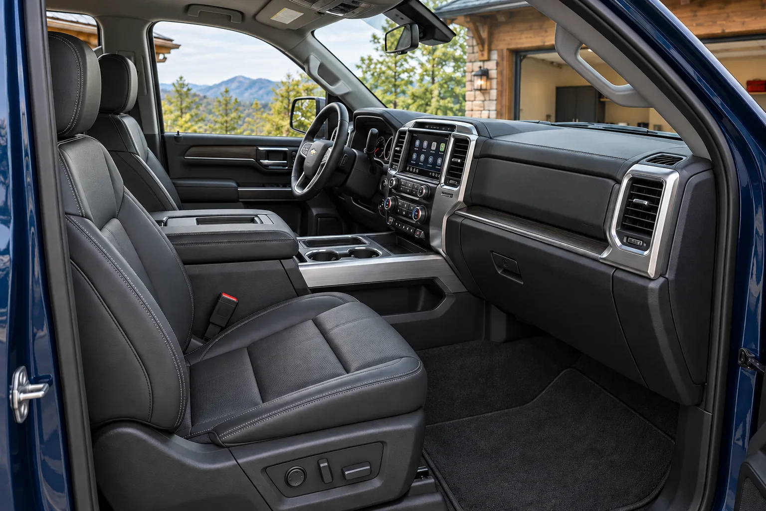 Charcoal leather interior of the same midnight-blue crew-cab pickup