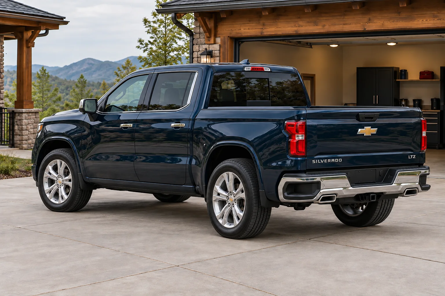 Rear three-quarter view of the midnight-blue pickup beside its residential garage